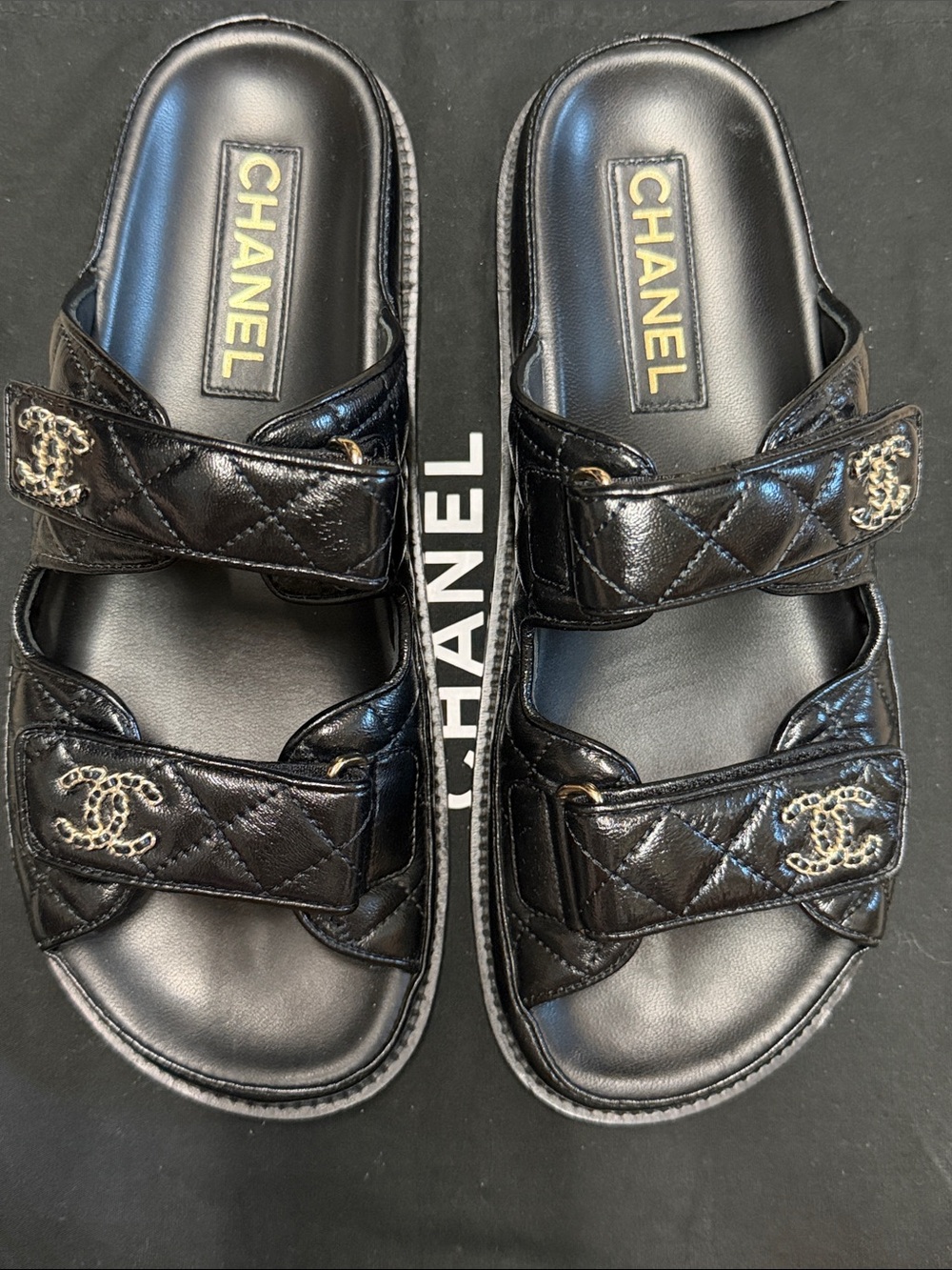 CHANEL Black Quilted Double-Strap Logo Slides with Gold Hardware